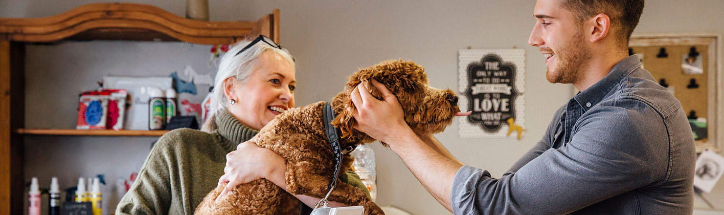 Woman and dog at vet