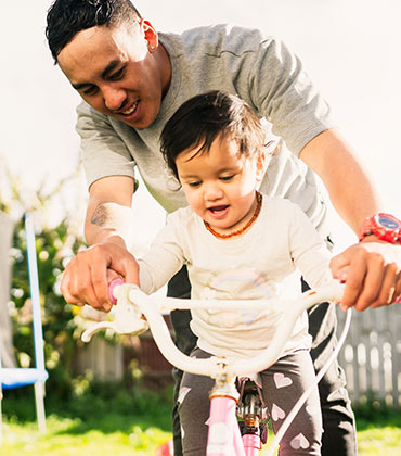 Father with child on bike