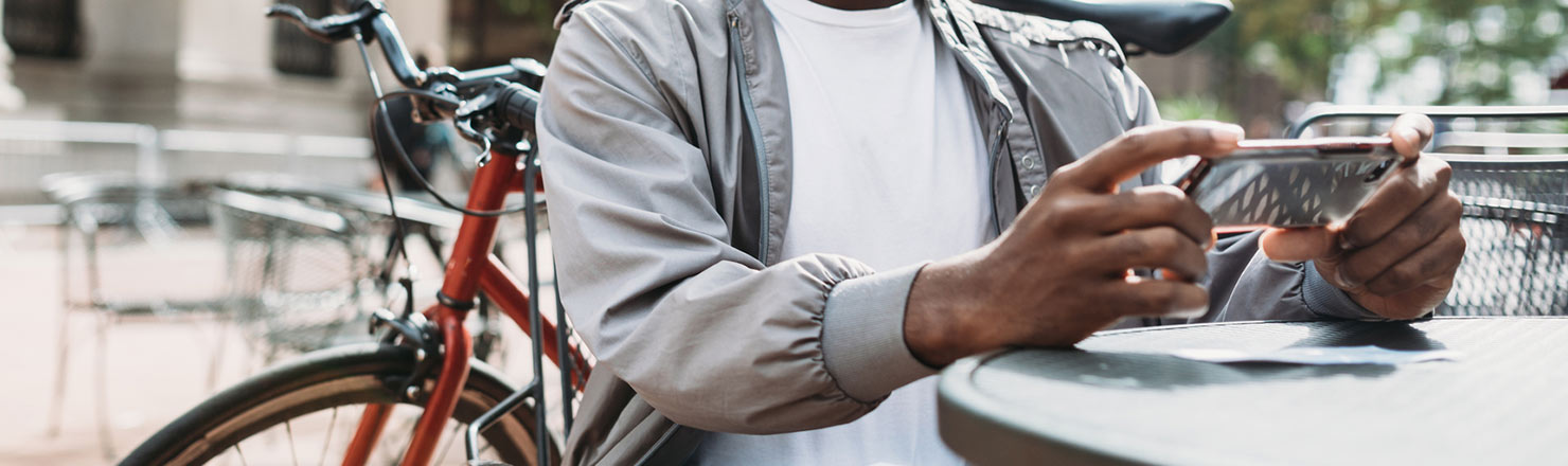 Man taking photo of check with phone