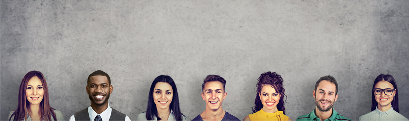 People lined up smiling with backdrop 