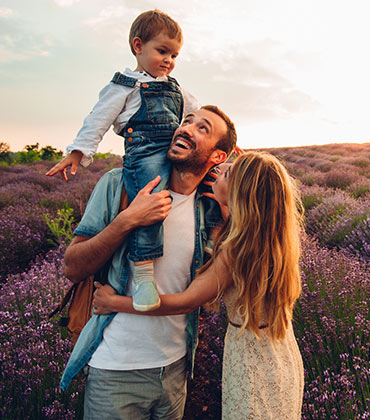 Family in field of flowers