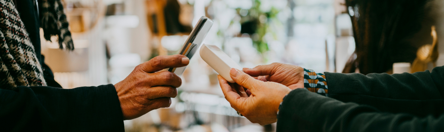 Women purchasing a good by tapping with her phone 