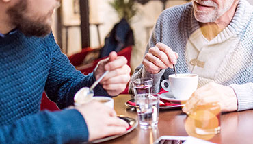 Two met drinking coffee